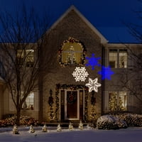Forgassa a mozgásfehér és a kék karácsonyfa világossugárzási dekorációját
